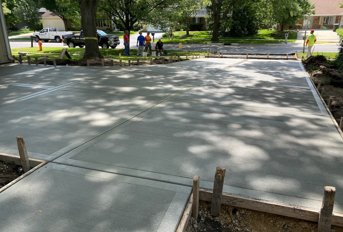 Professional concrete contractors installing a driveway in Woburn, MA